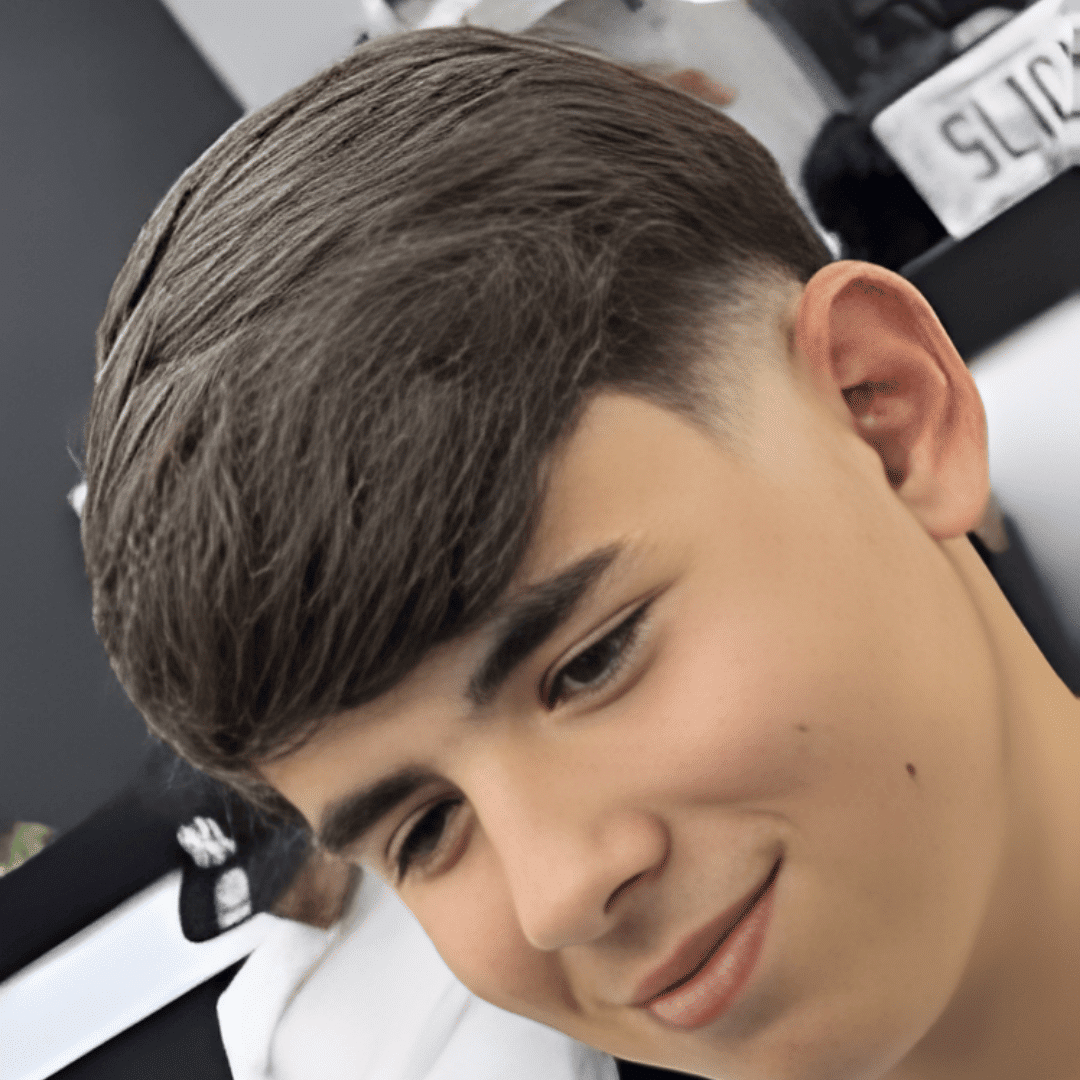 low skin fade with side swept fringe