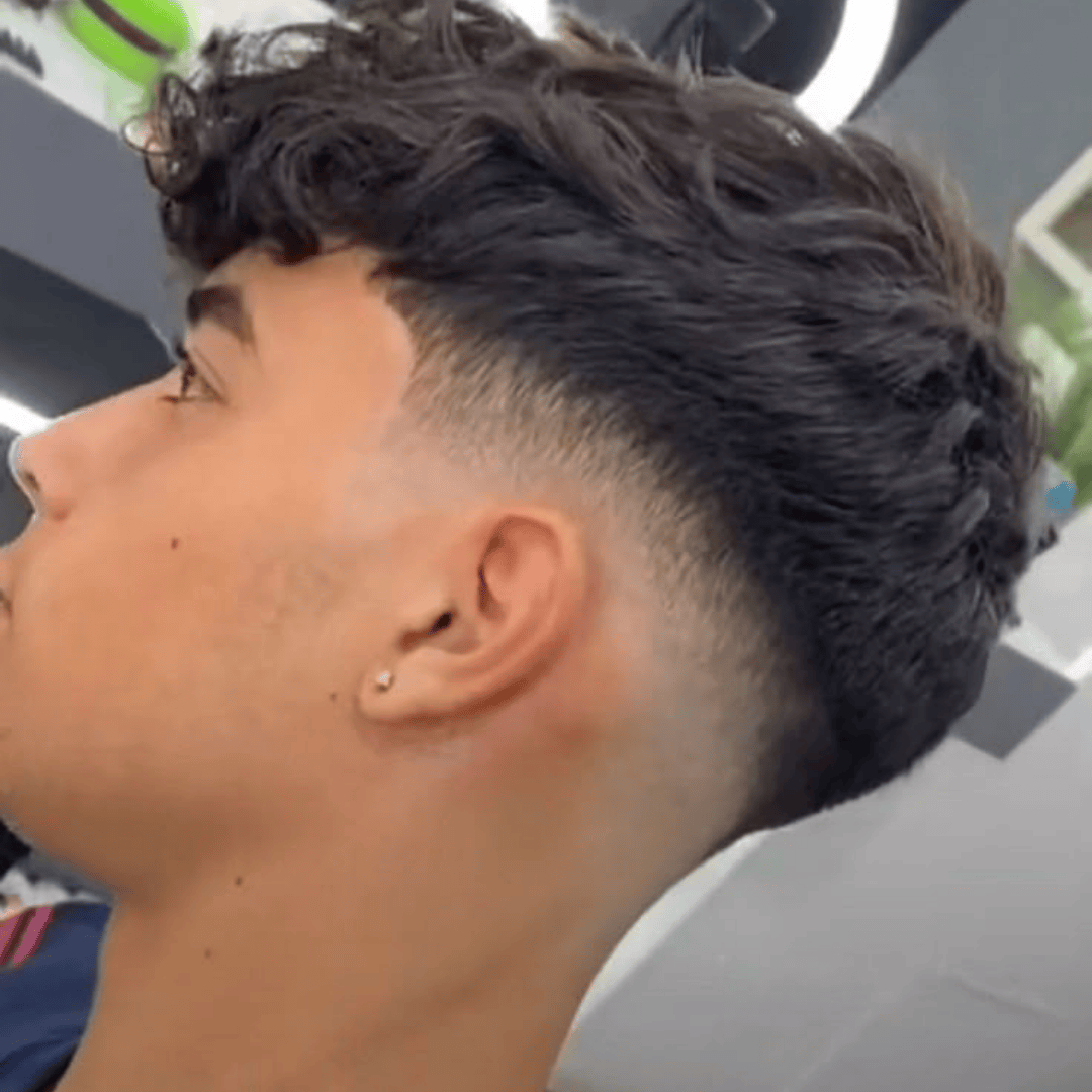 low skin fade with wavy fringe
