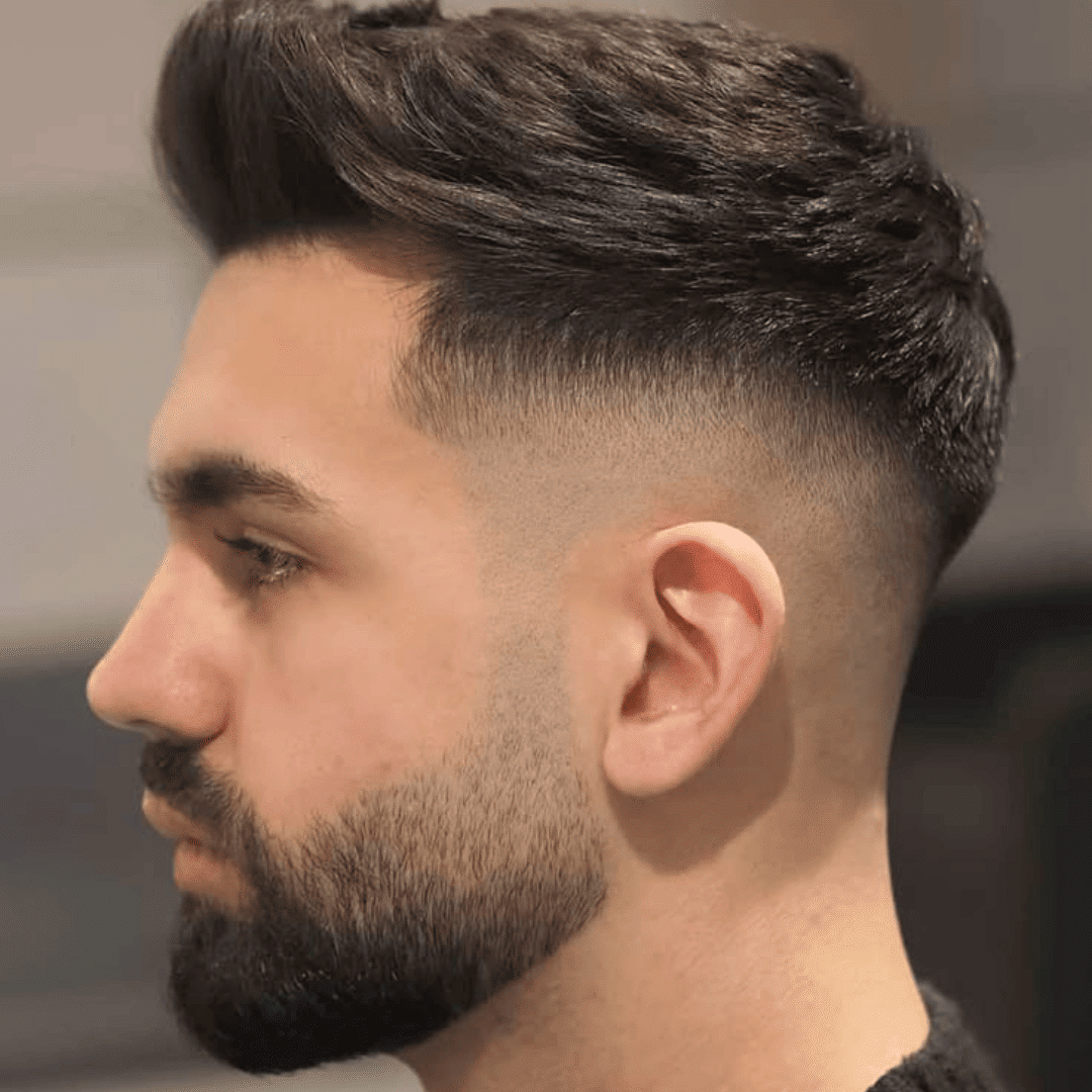mid skin fade with faux hawk