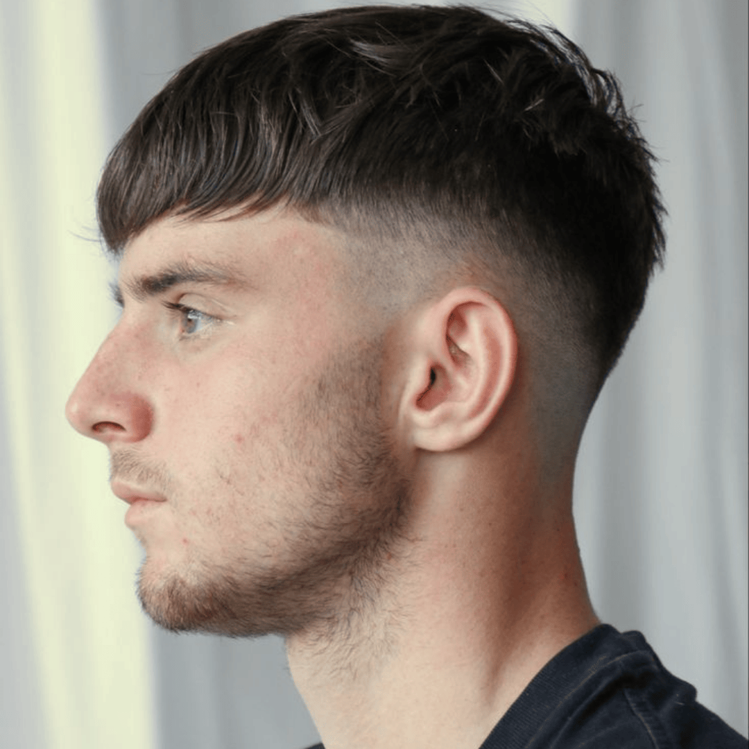 mid skin fade with textured crop