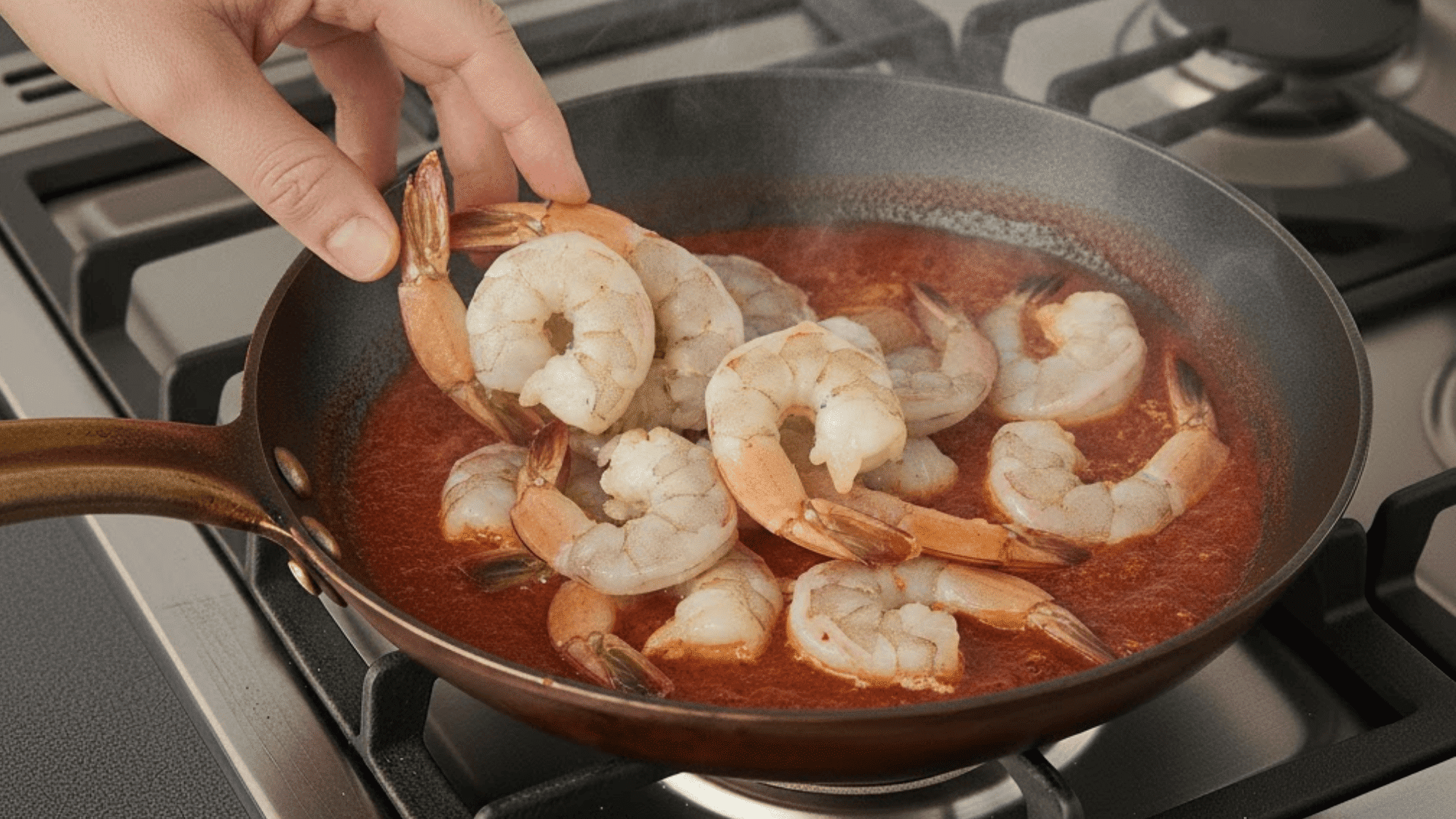 step 5 add and cook the prawns