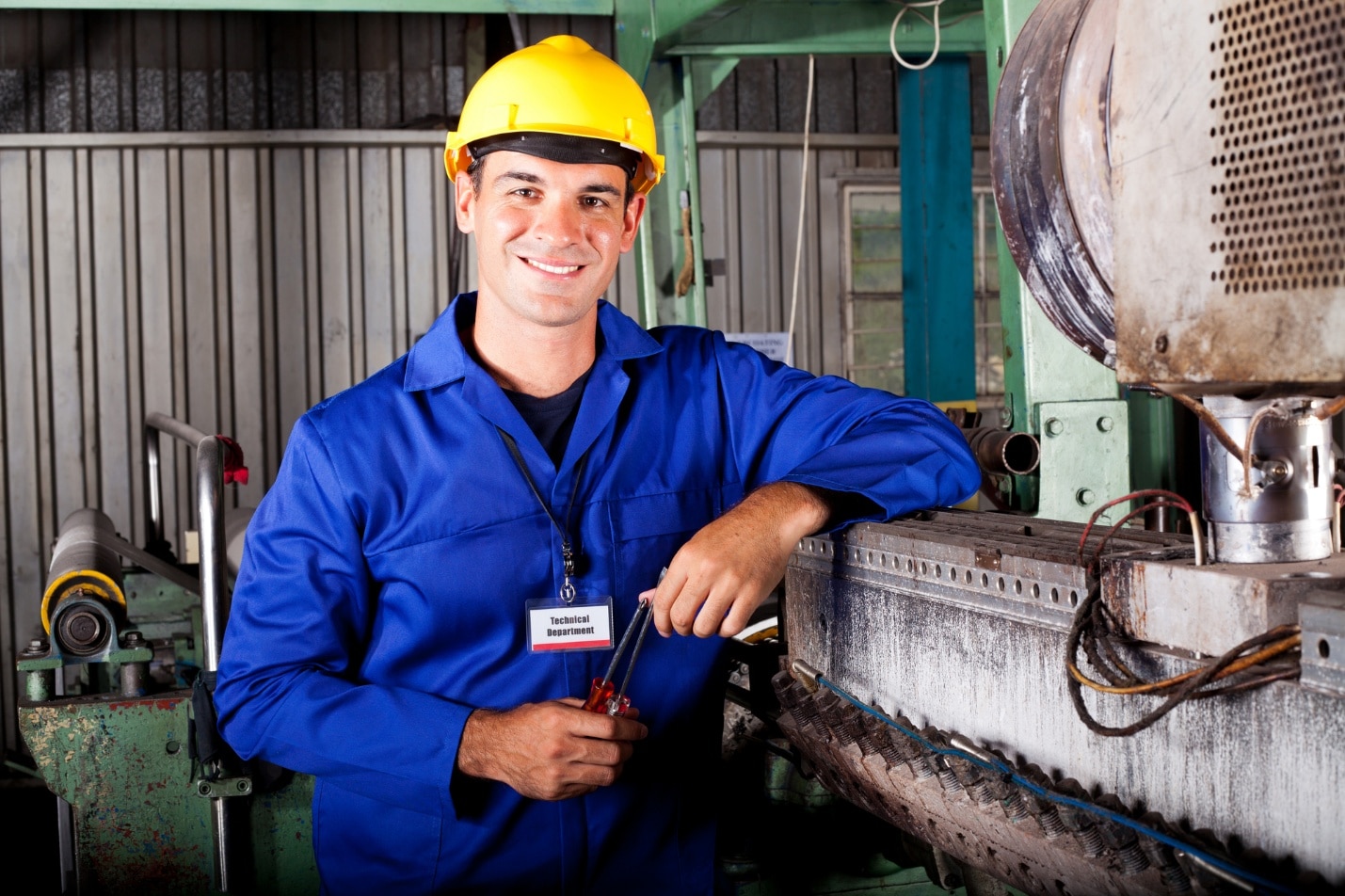 A person wearing a hard hat and blue jacket AI-generated content may be incorrect.