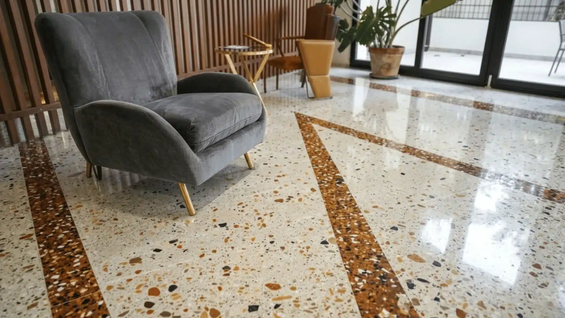 a high quality picture of a living with a grey sofa in beauty flooring also giving a outdoor view