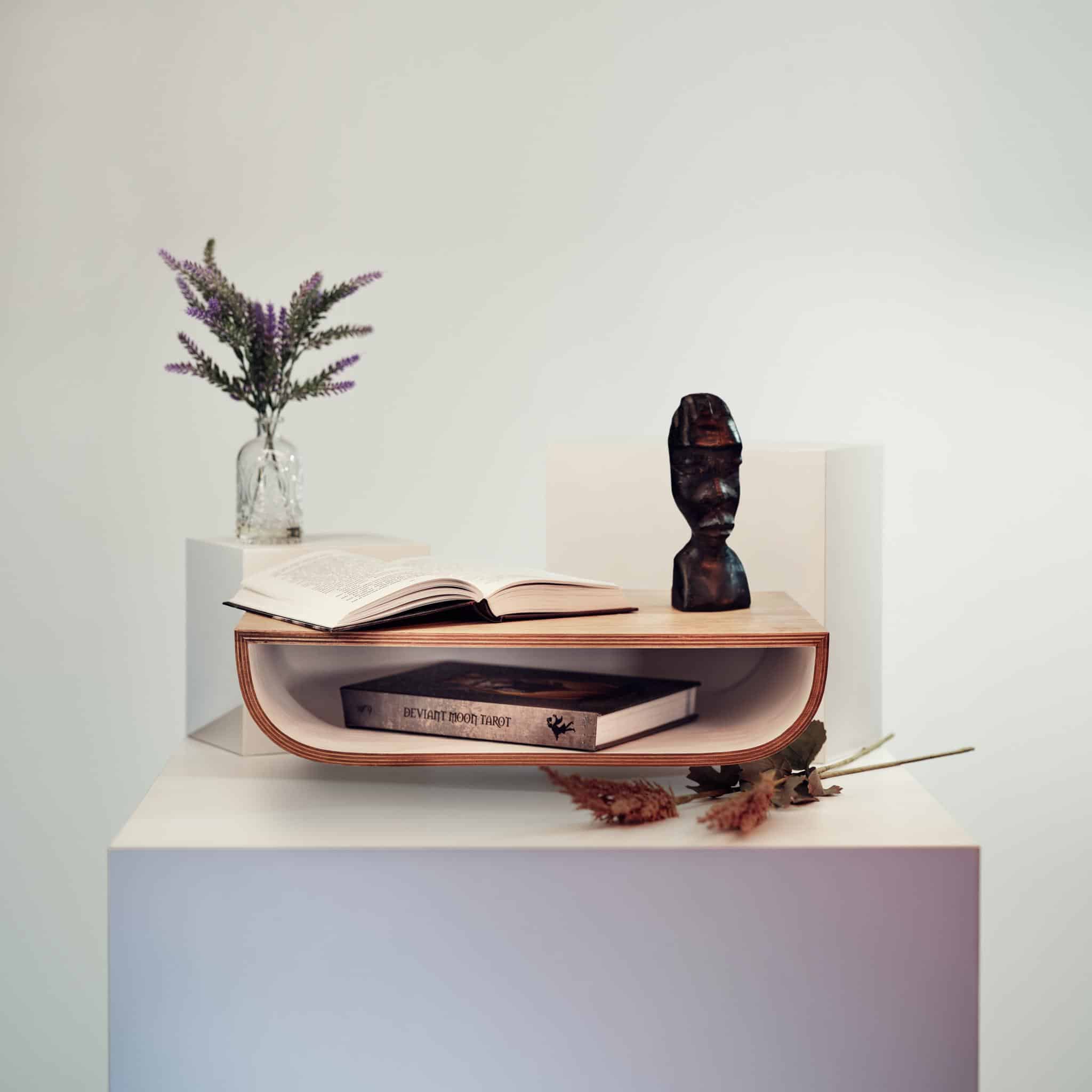 floating nightstand near bed for a lamp or book