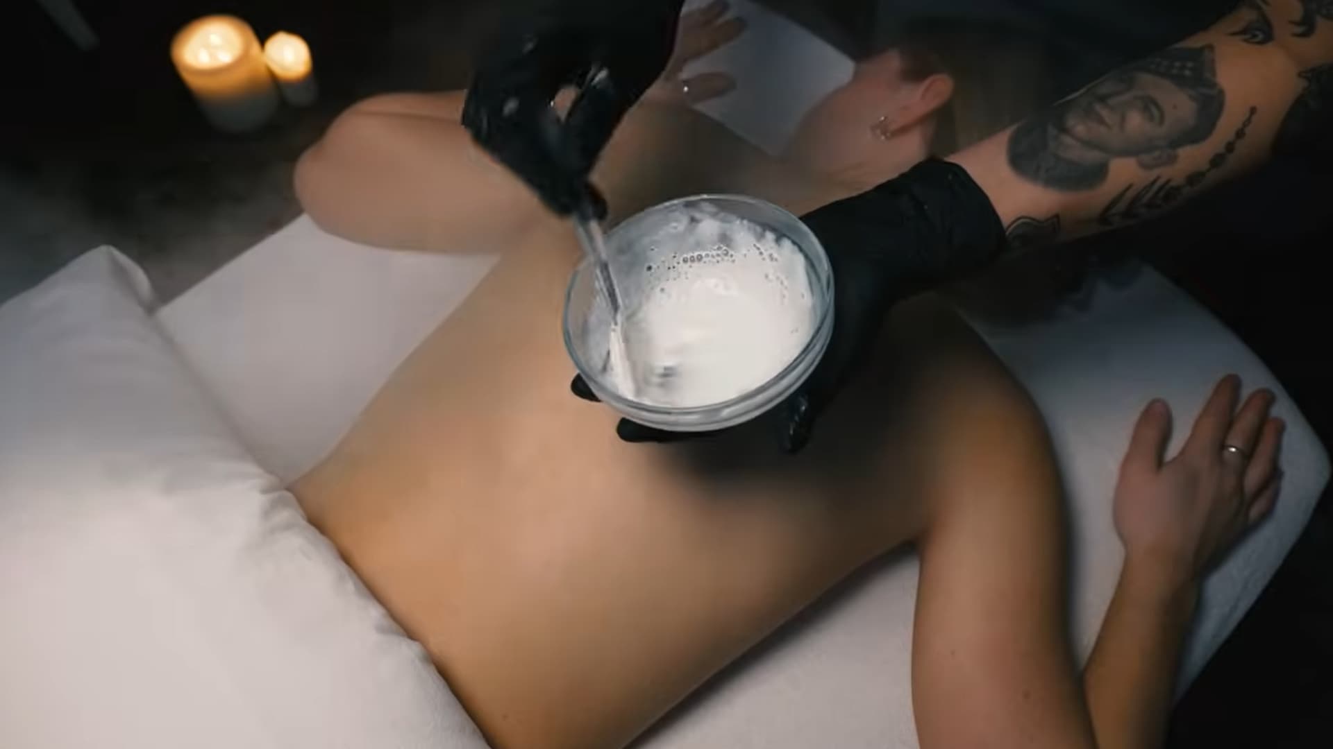 preparing a enzyme treatment for the back facial, with the product being mixed and ready for application on the skin