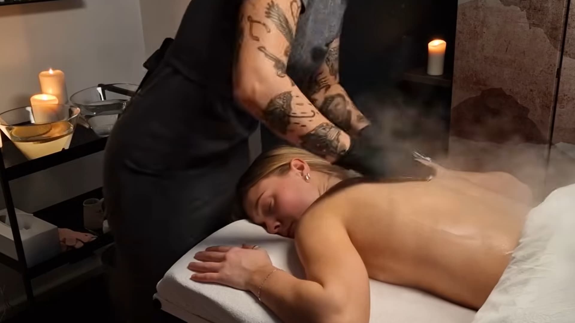 professional back facial treatment in progress, with steam and cleansing products applied to the client's back for relaxation