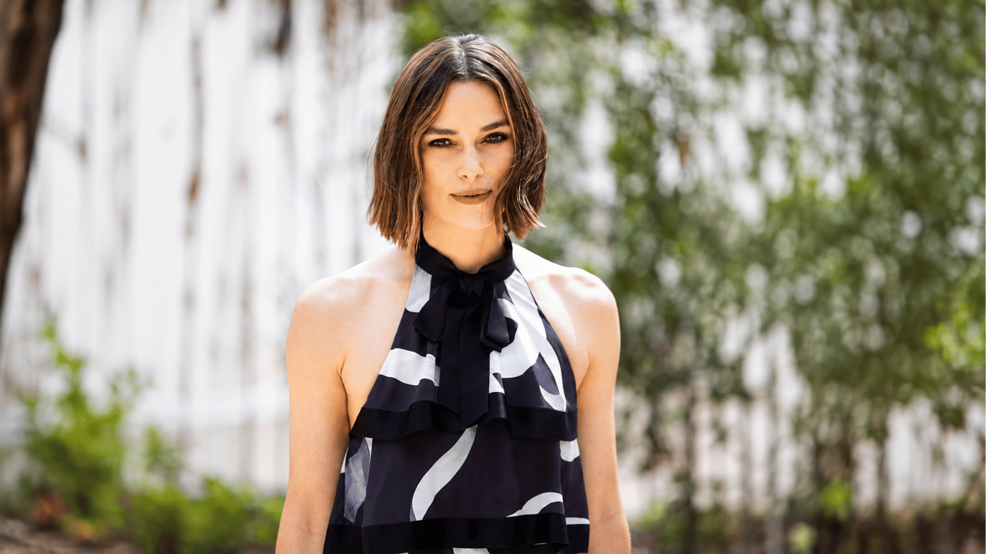 a layered bob for wavy hair with tousled ends and face framing layers creates a soft textured look with natural movement