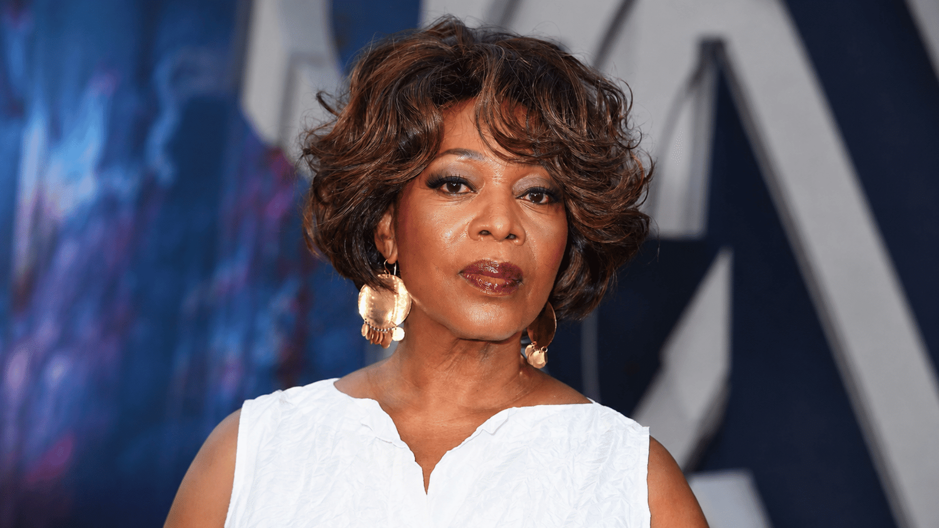 a layered bob with fine hair styled in soft waves and light layers creates fuller shape with airy volume and gentle movement