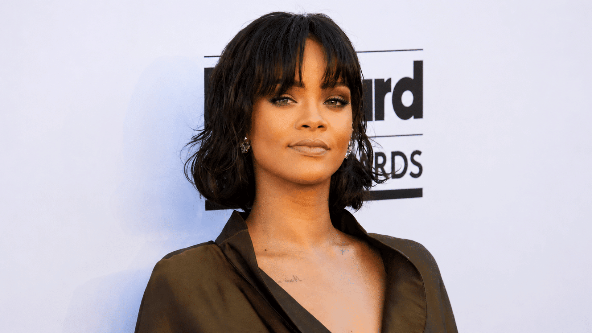 a layered bob with wispy bangs and soft tousled waves creates a chic hairstyle with airy texture and natural movement