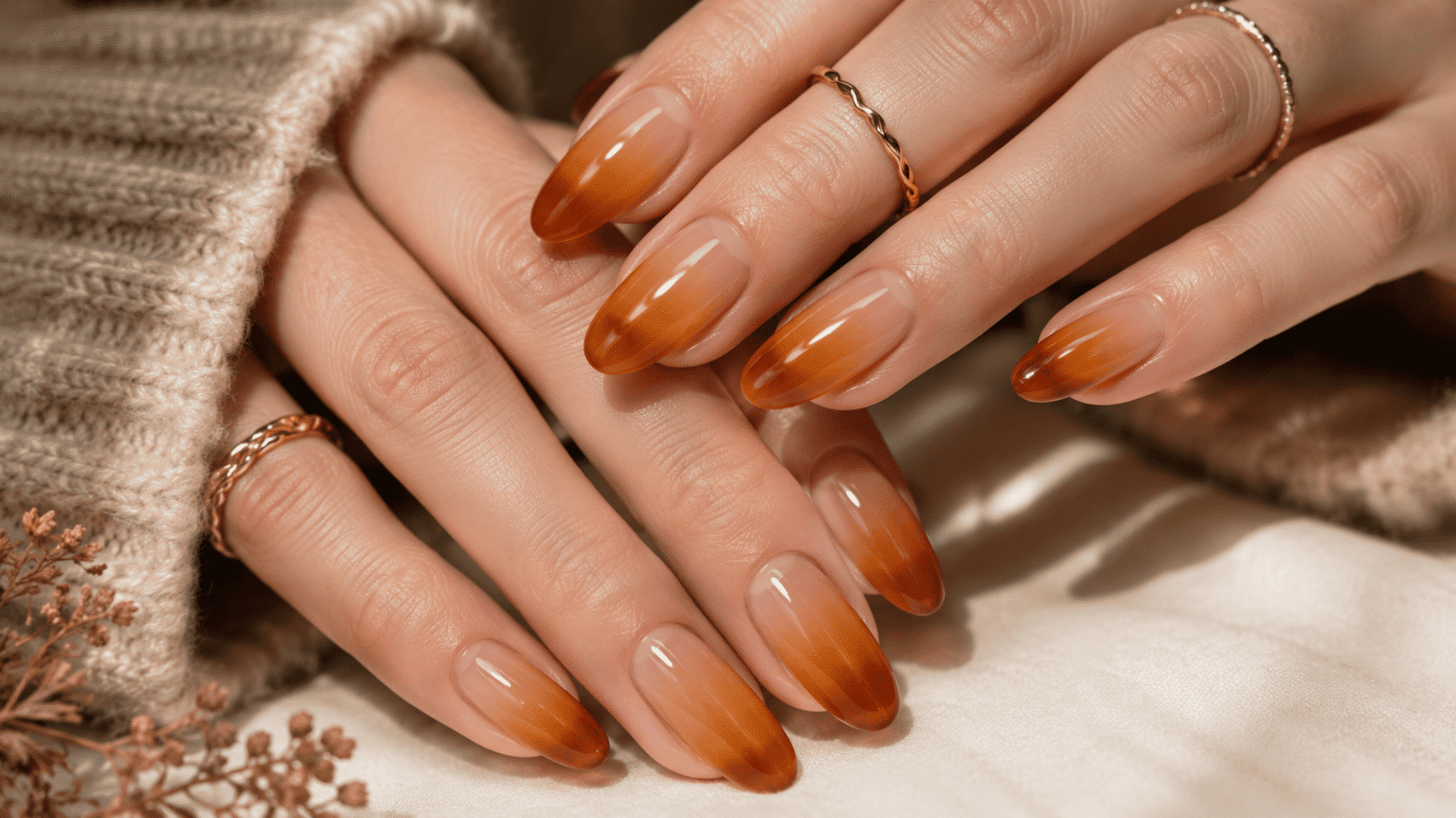 amber jelly fall ombre nails with translucent nude bases fading into warm amber orange tips