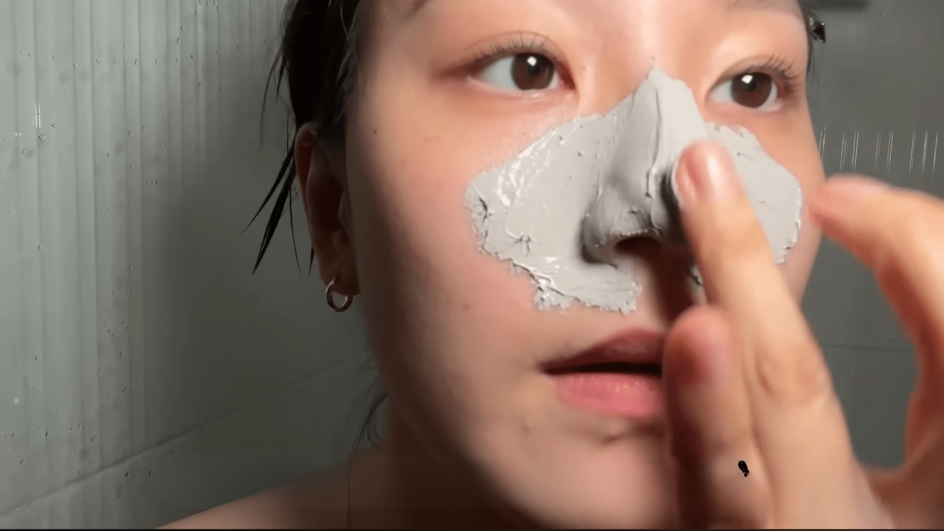 applying a clay or mud mask over the nose to absorb excess oil and reduce the appearance of clogged pores