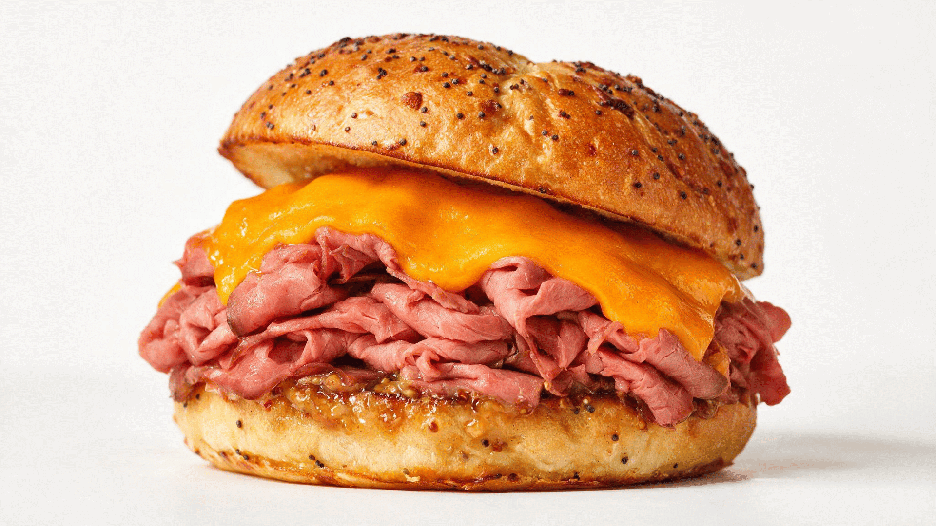 arby’s-style roast beef sandwich with thin-sliced beef and melted cheddar cheese on a toasted bun