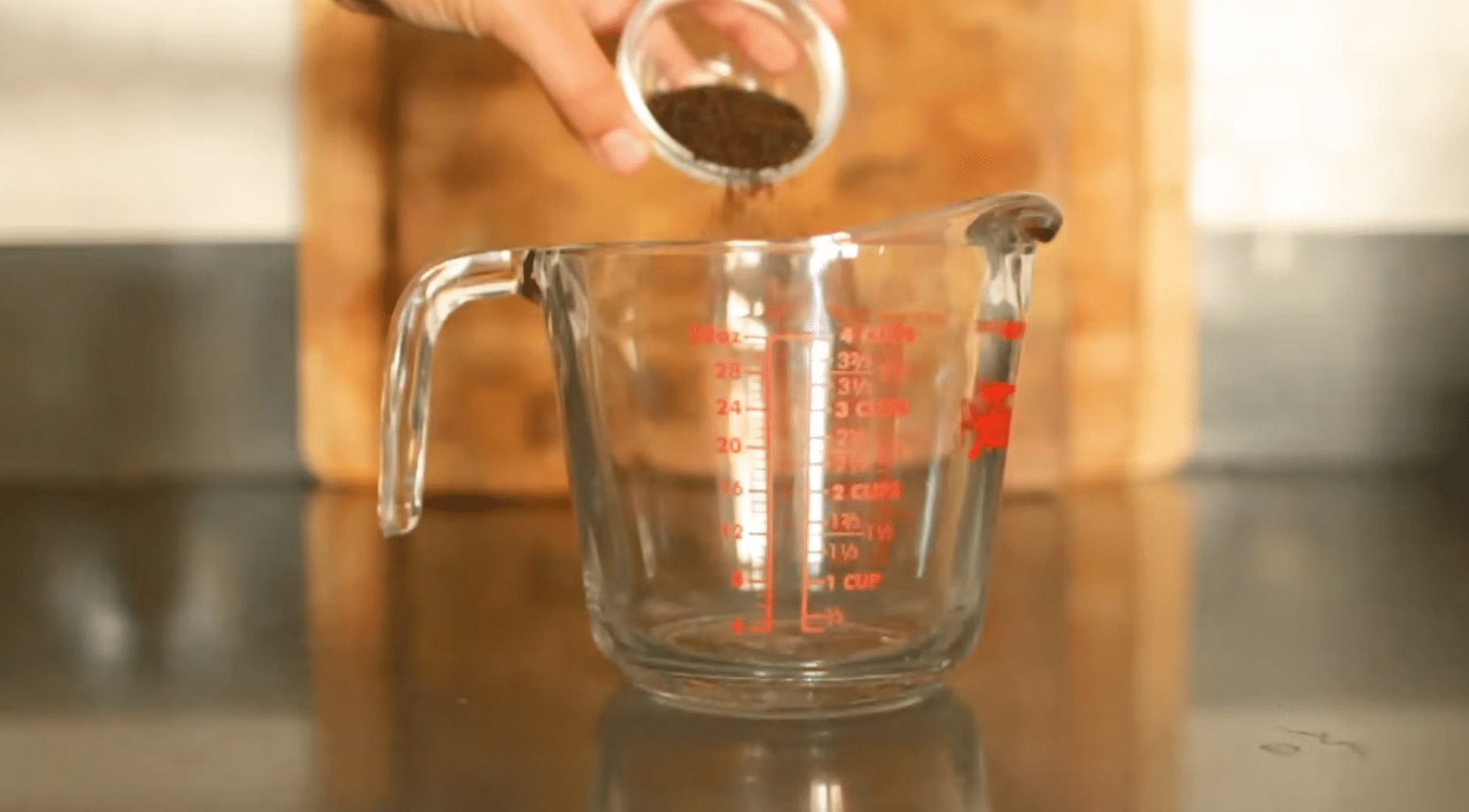 brewing black tea in hot water for homemade kombucha before starting the first fermentation process