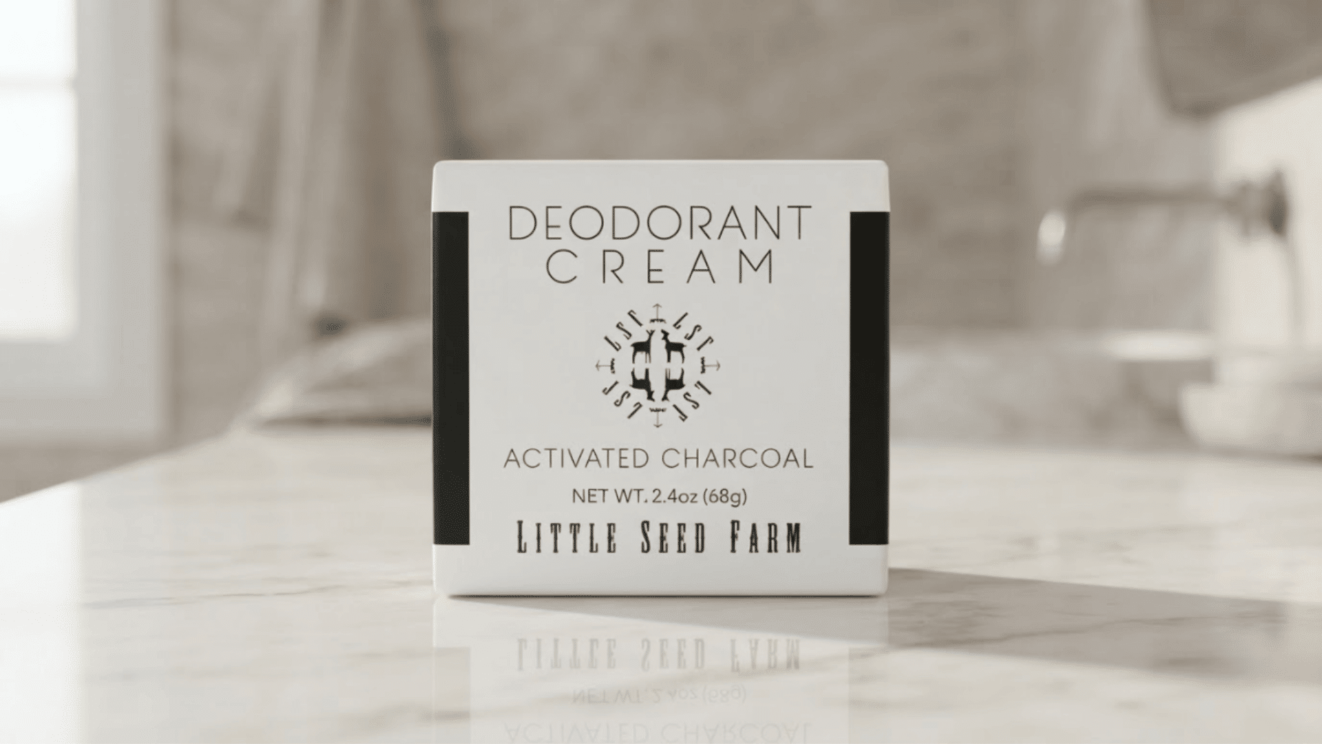 Charcoal deodorant cream box placed on a counter for best natural deodorants