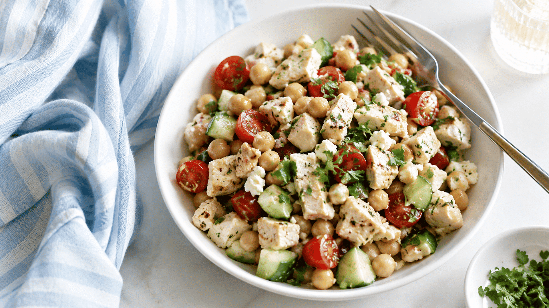 chicken and chickpea salad with cucumber cherry tomatoes feta and fresh herbs