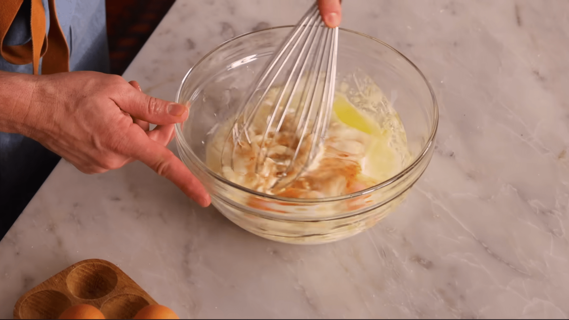 combining wet and dry ingredients gently to prepare smooth chocolate sheet cake batter