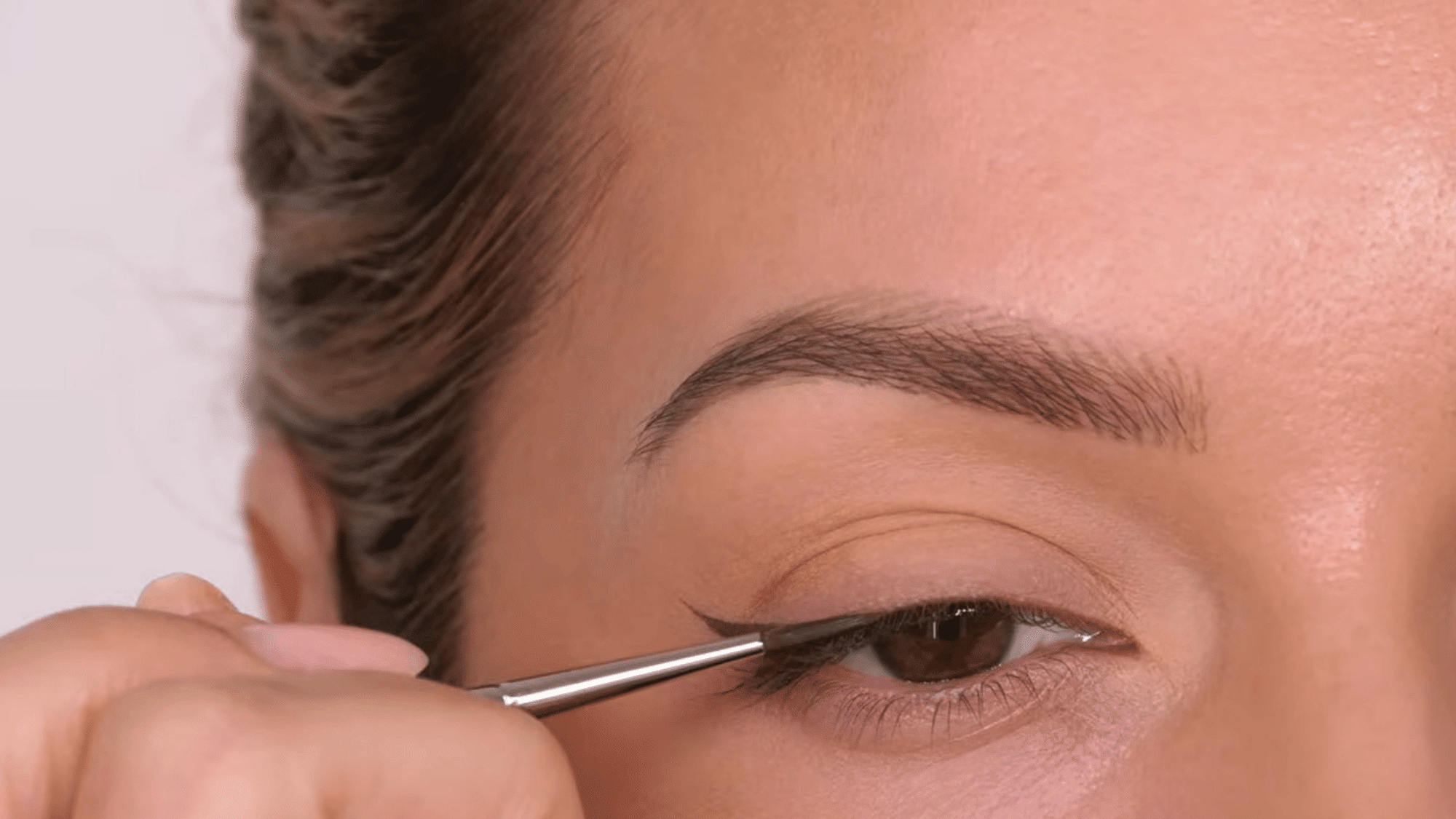 connect the wing to the lash line for a smooth continuous eyeliner shape with a clean defined finish
