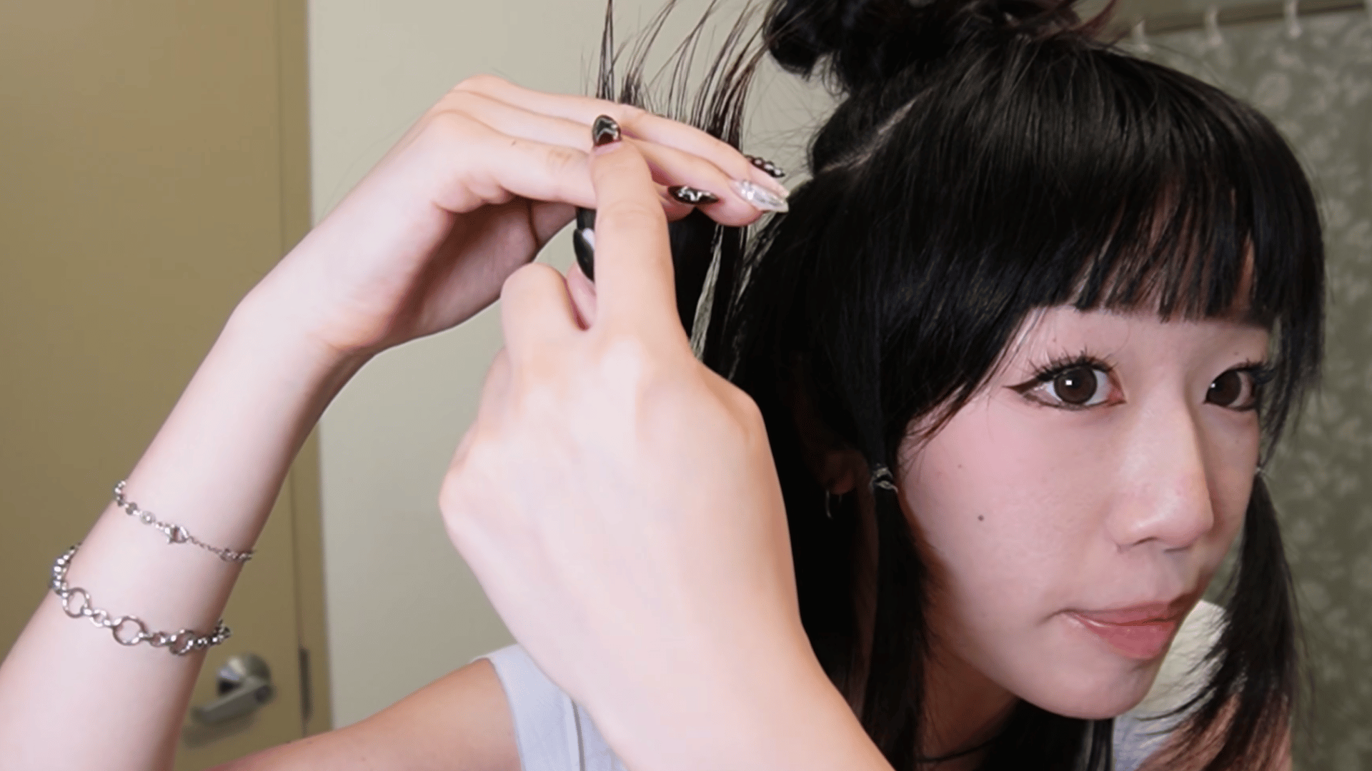 cutting the bottom layer of hair while creating the base shape for a jellyfish haircut