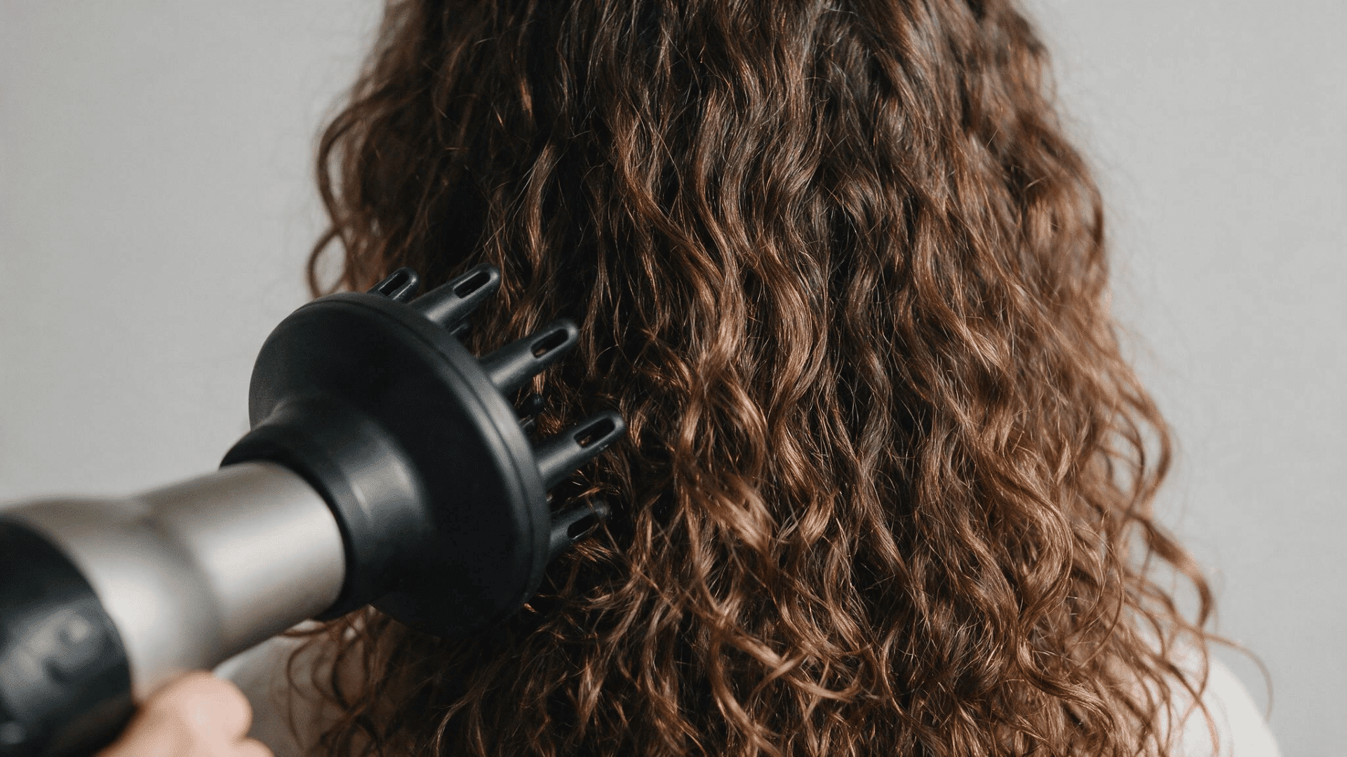 diffuser drying curly hair to help maintain curl shape and add volume