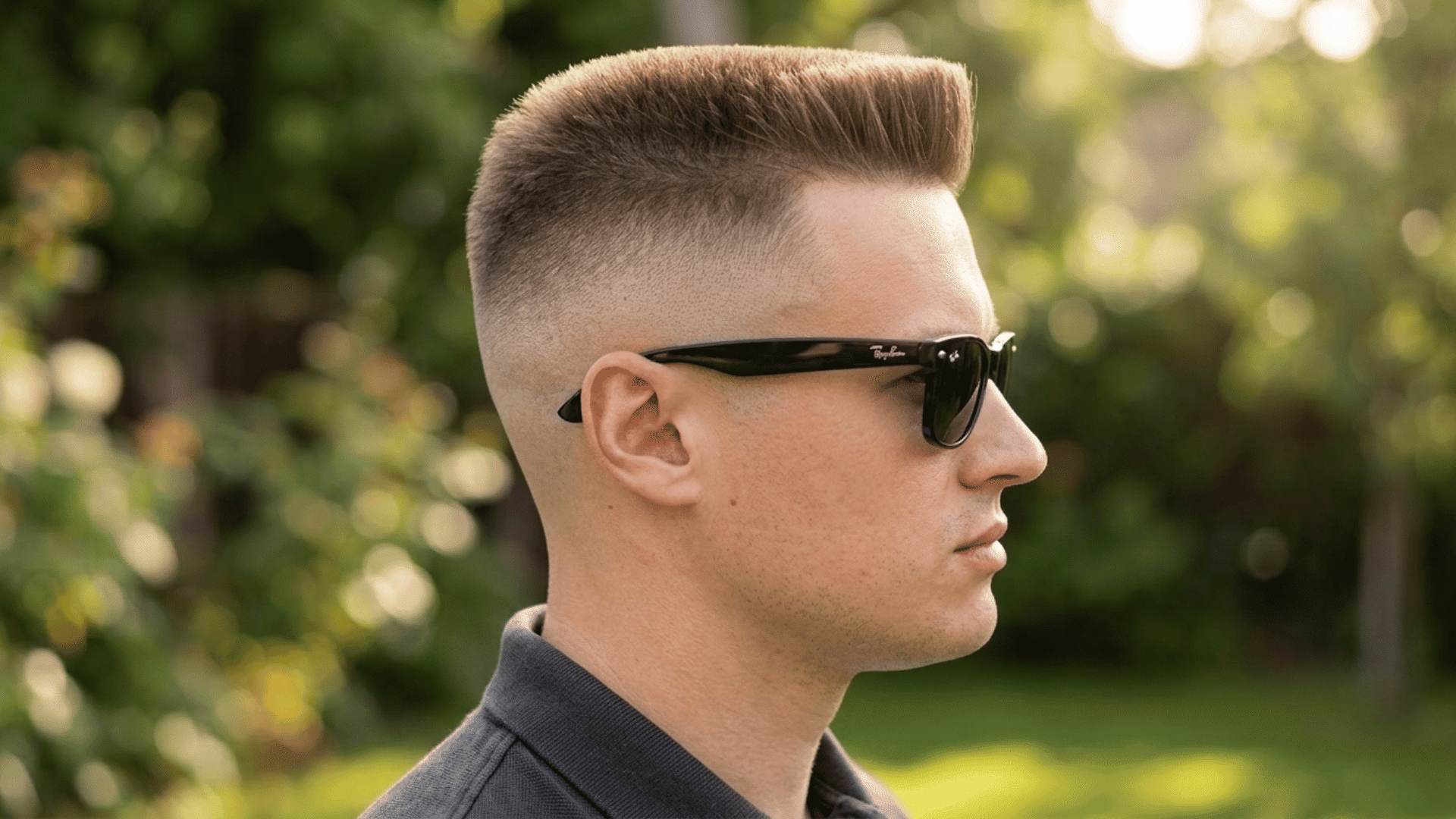 flat top mohawk with a squared upright top and closely faded sides