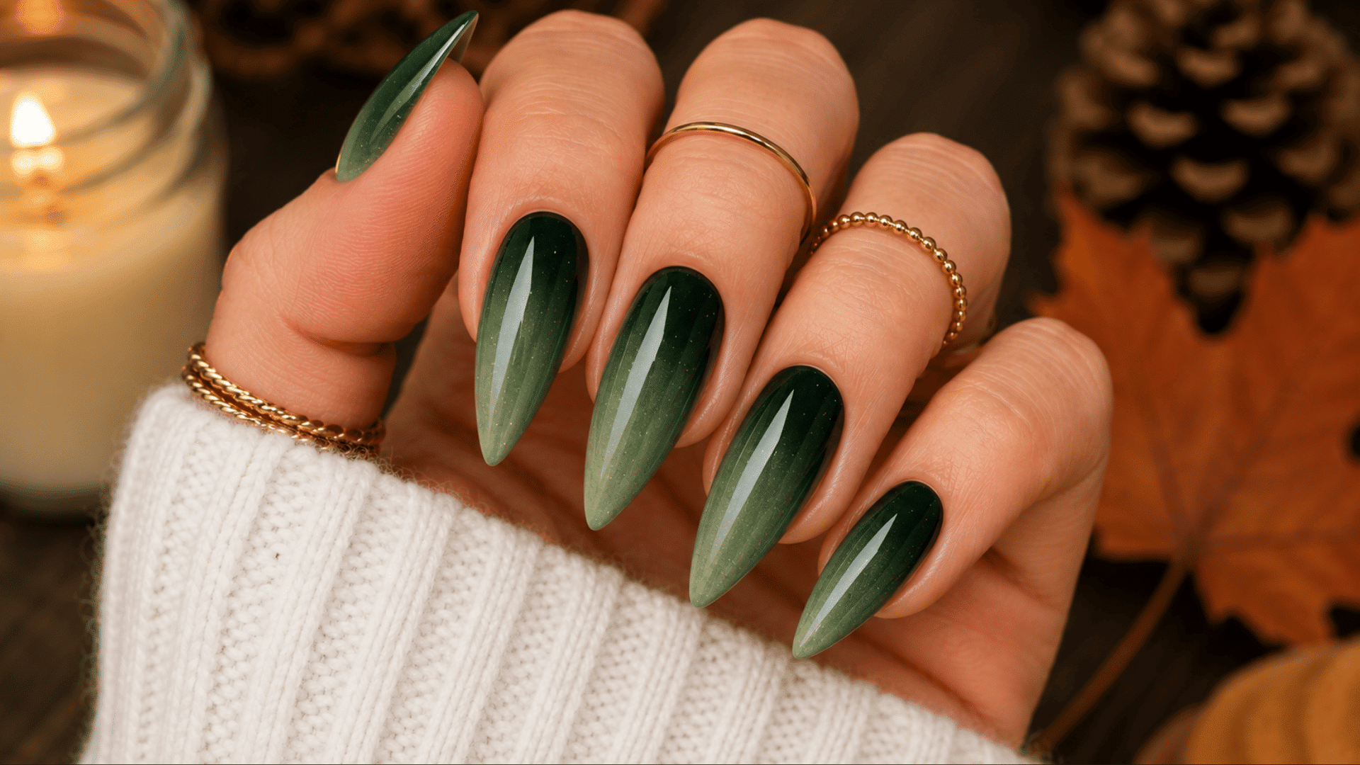 forest green skittle ombre nails with glossy shades ranging from light green to deep forest green