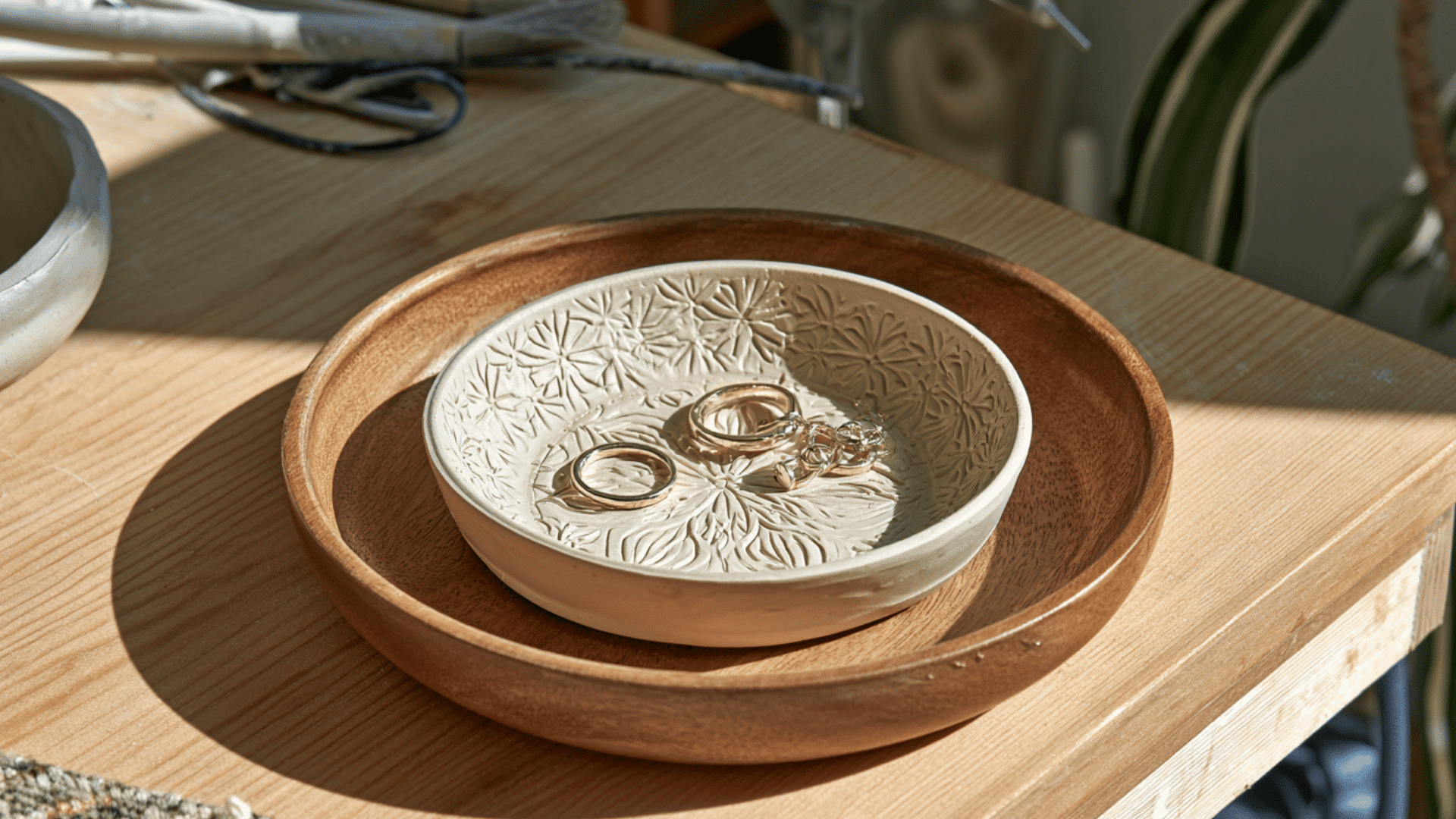 handmade clay trinket dishes with colorful textures holding rings earrings and small essentials