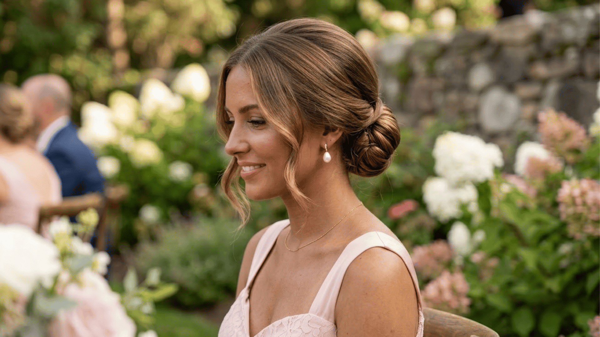 low chignon hairstyle with a smooth bun for formal wedding bridesmaid look