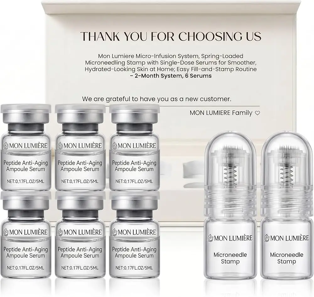 Skincare ampoules and microneedle stamps on reflective surface with packaging in background