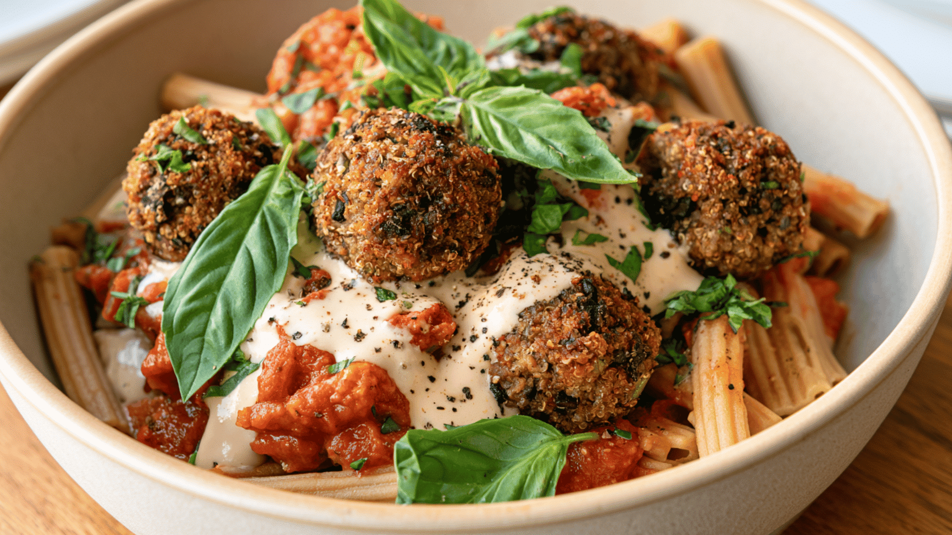 mushroom quinoa meatballs with lentil pasta tomato sauce cashew cream and fresh basil