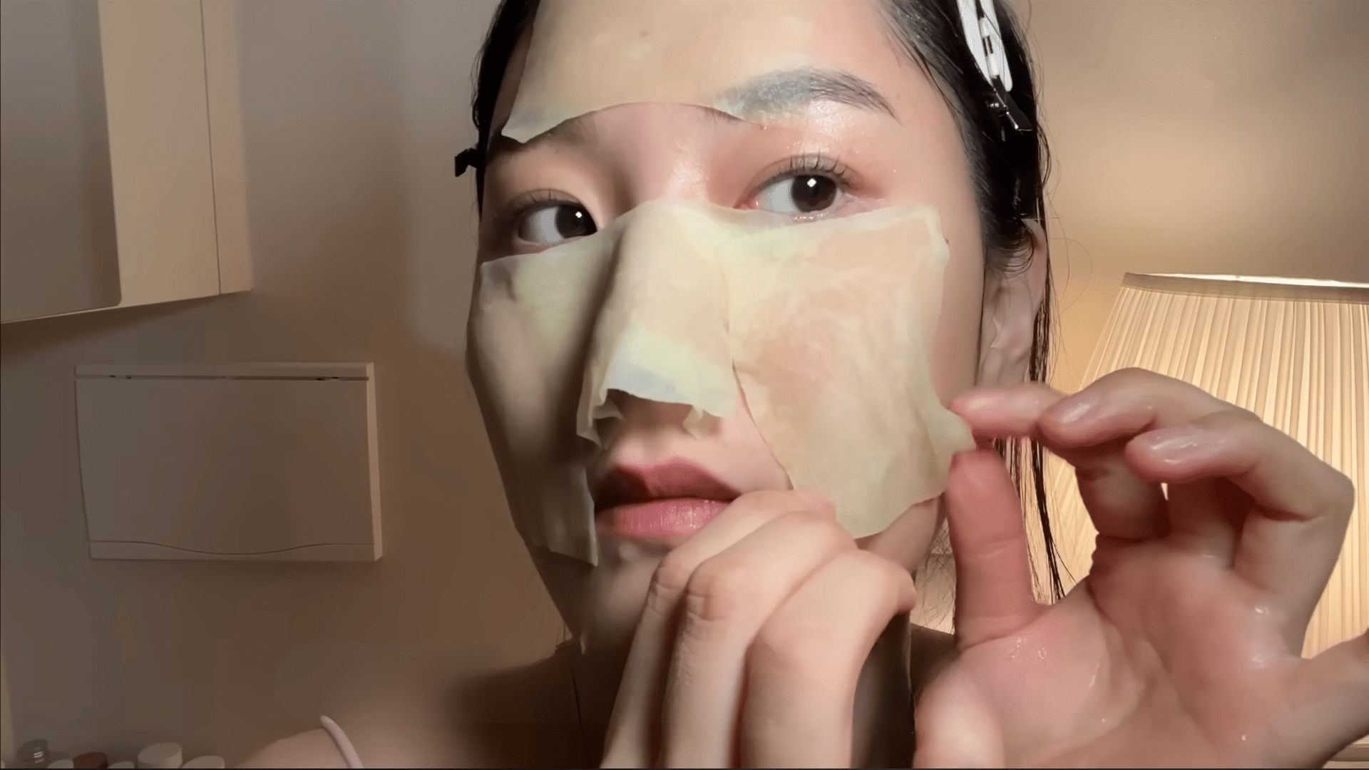 placing chilled green tea soaked cotton pads on the nose to calm and refresh skin after pore cleansing