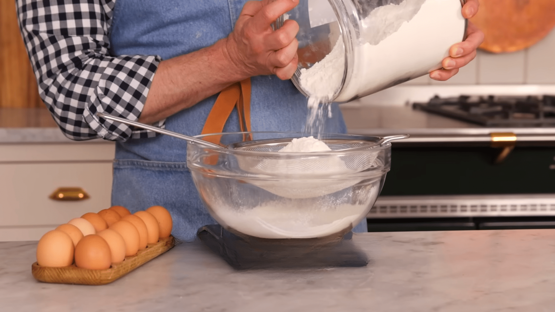 preheating oven and combining dry ingredients for chocolate sheet cake batter