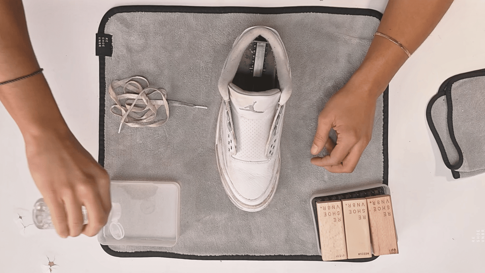Prepare a cleaning solution for how to clean white shoes using mild ingredients beside white shoes for stain removal.