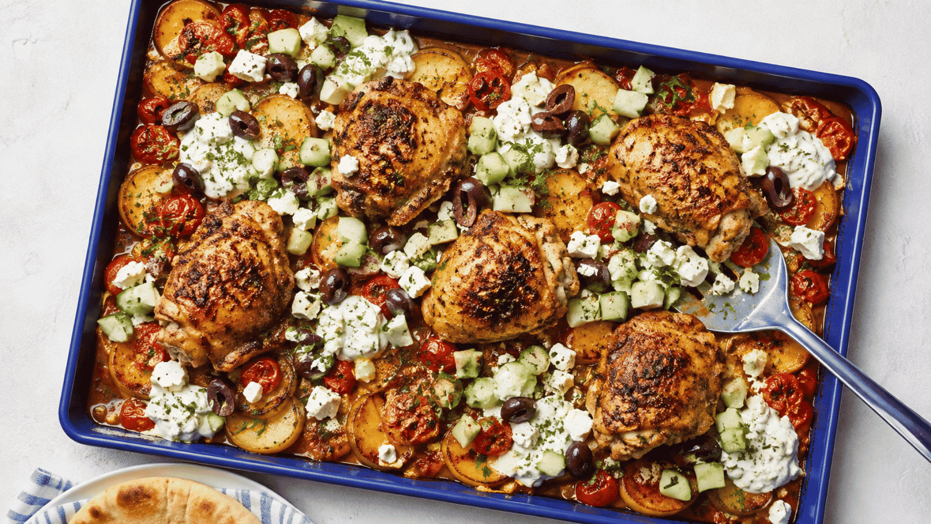 roasted chicken with broccoli asparagus carrots onions and lemon on a sheet pan