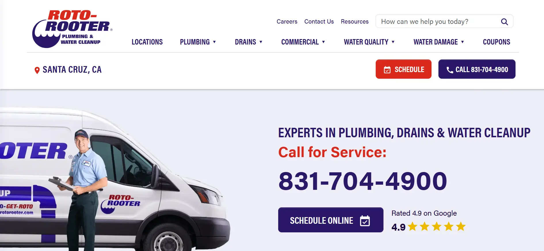 Roto-Rooter employee standing beside branded van holding clipboard in a business uniform