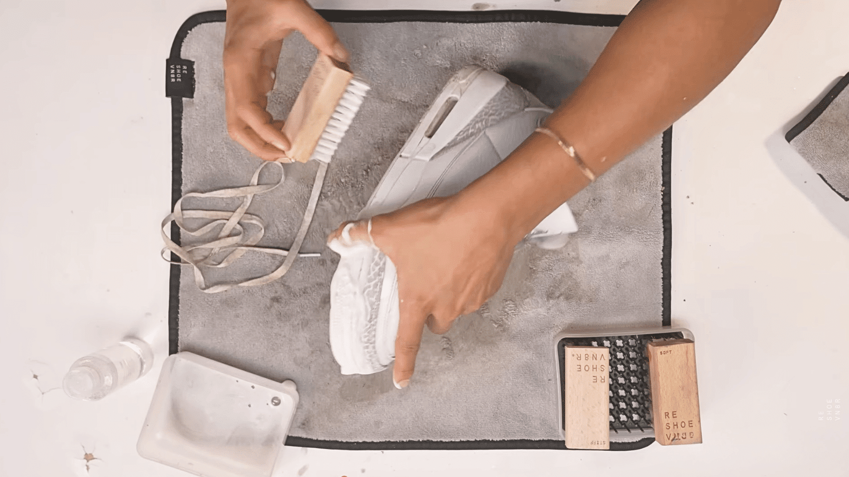 Scrub the shoe soles in how to clean white shoes steps using a brush to remove marks and dirt from bottom areas daily.