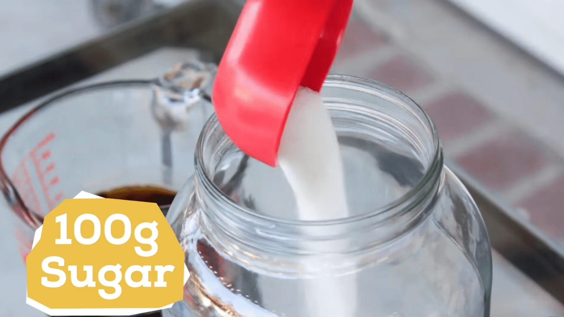stirring sugar into freshly brewed tea and cooling the mixture before adding the kombucha starter