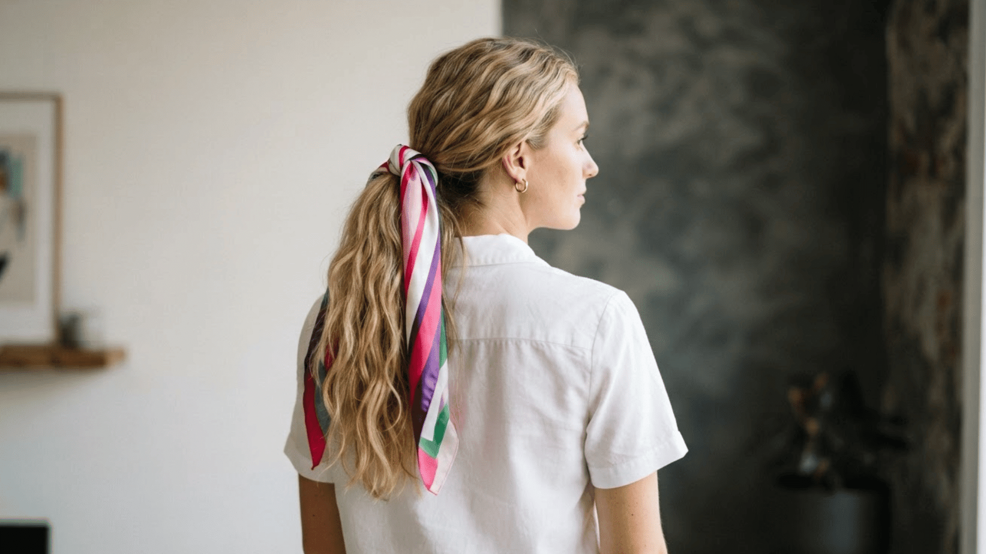 scarf tied around a ponytail adding a stylish touch to a simple everyday hairstyle