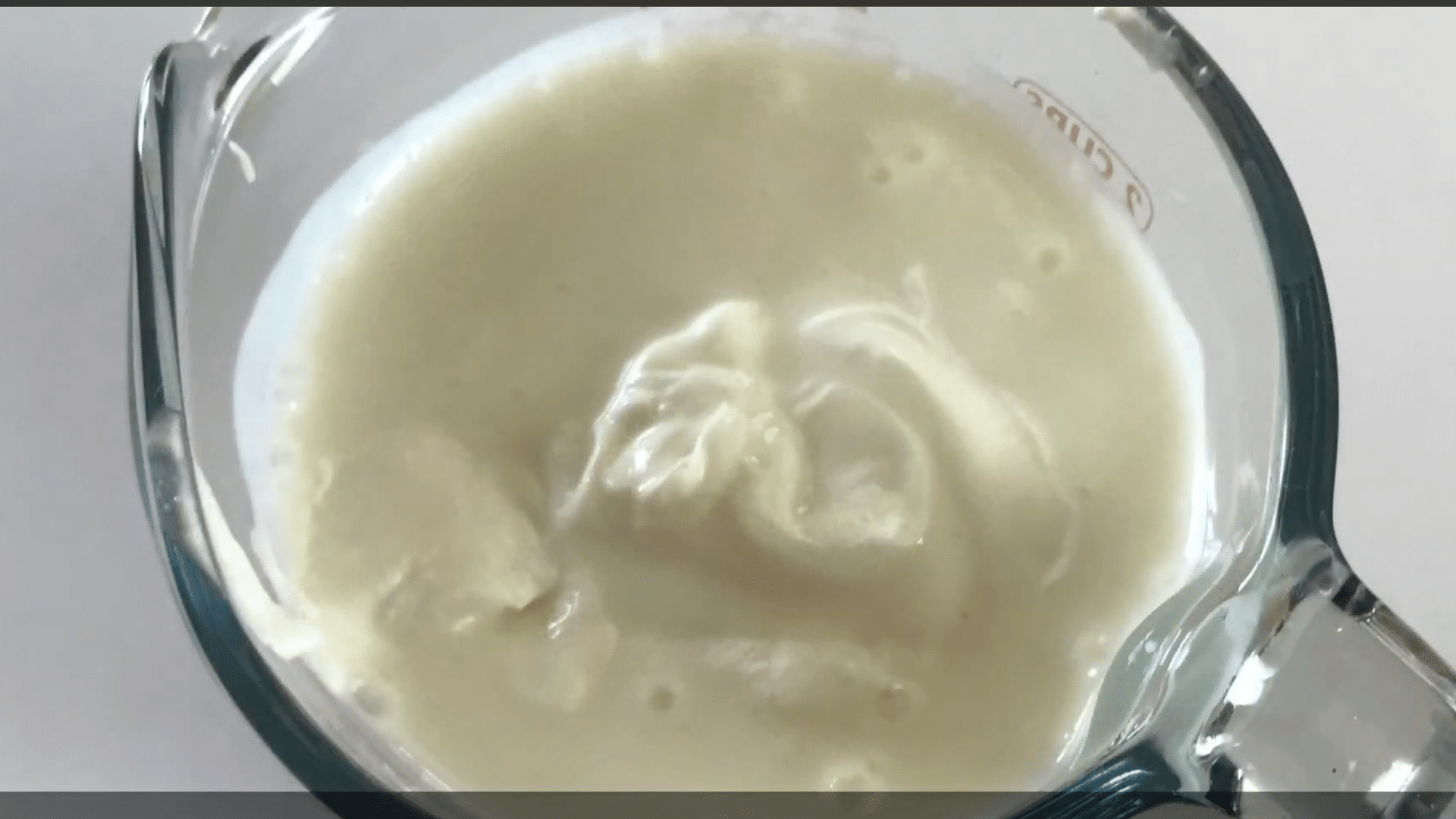 kefir or plain yogurt added to frozen peaches and almond milk for a creamy healthy peach smoothie