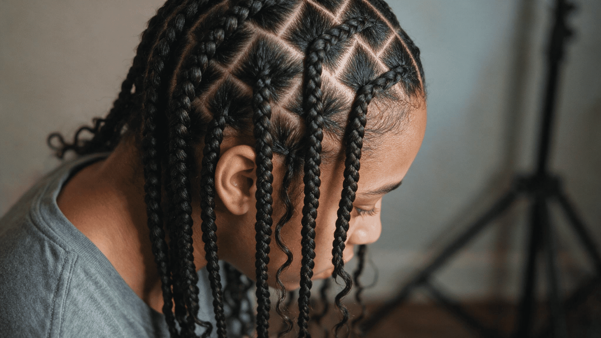 box braids with clean square sections and long individual braids hanging naturally around the head