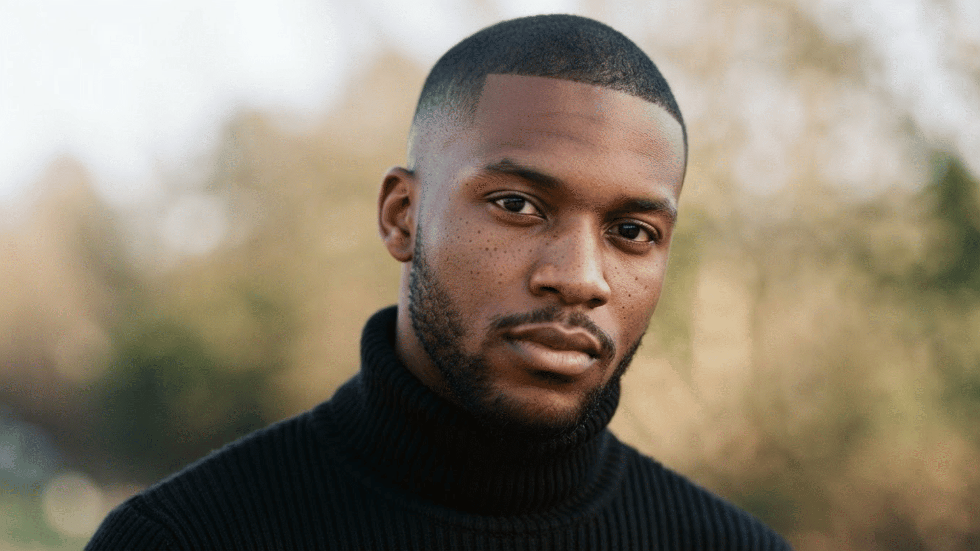 man with thinning hair wearing a short even buzz cut