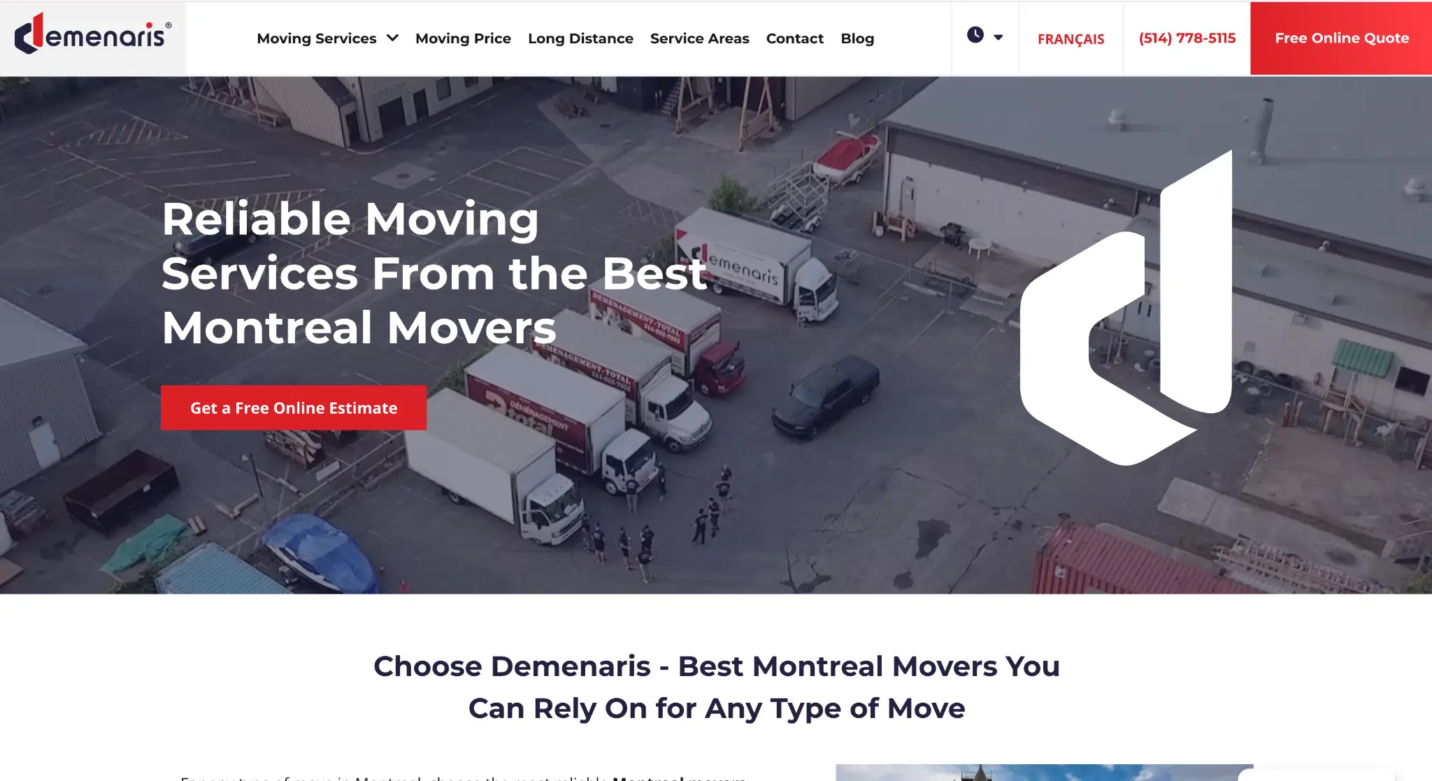 Moving trucks parked in industrial lot with people standing nearby in daylight