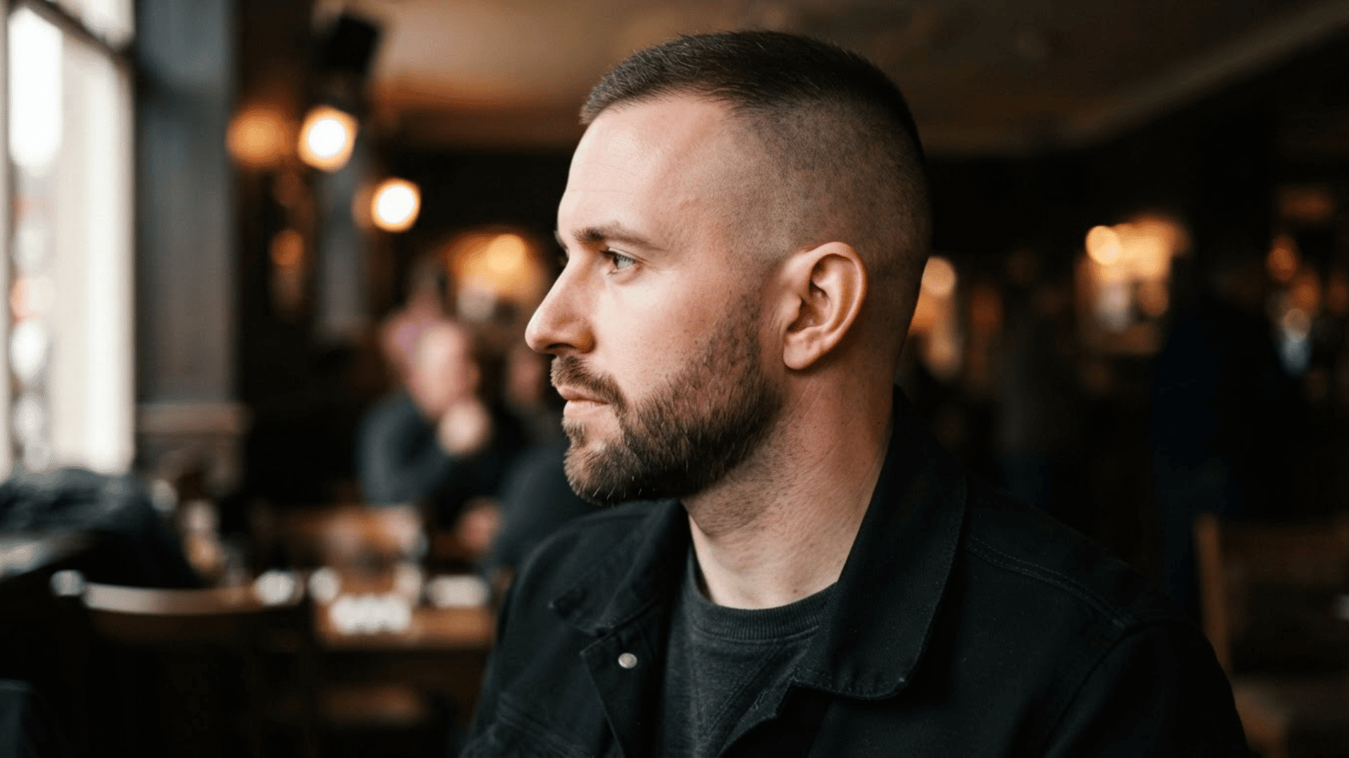 man with thinning hair wearing a high and tight haircut with very short sides and a cropped top