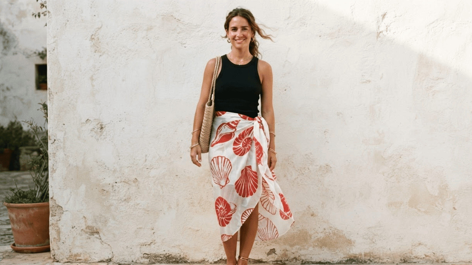 scarf styled as a sarong wrapped around the waist creating a breezy elegant look for warm weather
