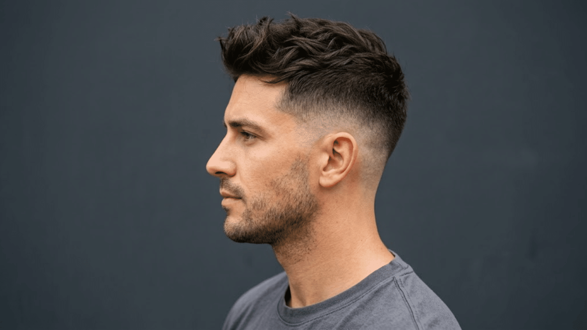 man with thinning hair wearing a short textured quiff with faded sides and lifted hair at the front