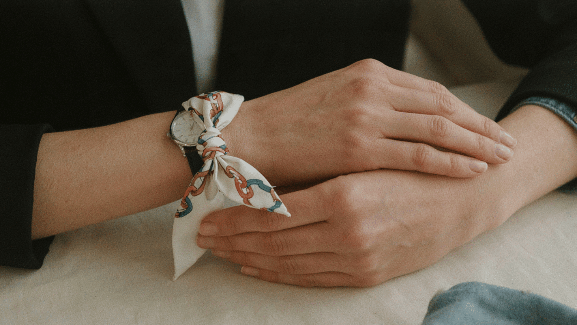 scarf tied around the wrist as a stylish accessory adding a chic touch to an outfit