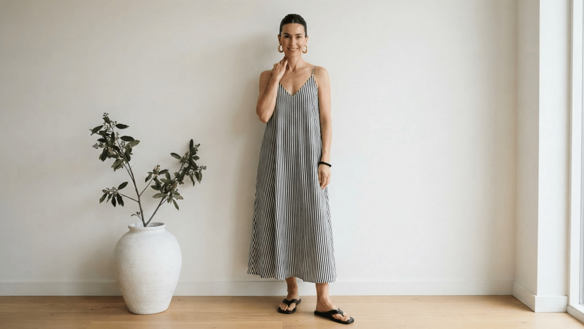 woman wearing a trapeze dress with a loose a line silhouette and flowing shape
